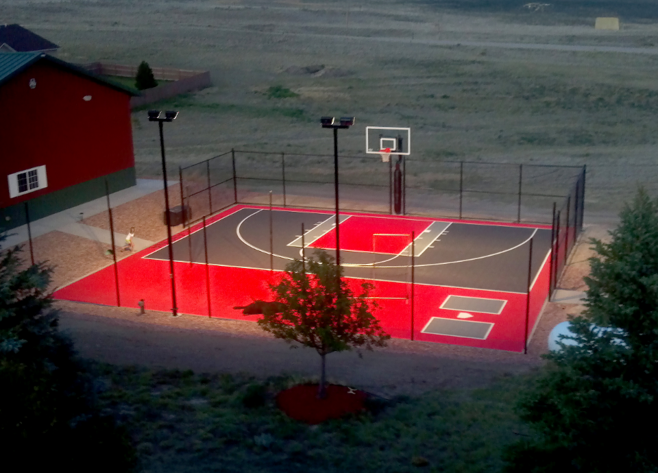Basketball Court with Lights, Fencing, and Ball Rebounder